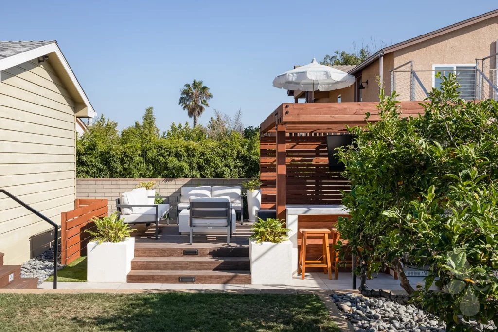 Home Exterior Back with Hardscape, Xeriscape, Surrounding Landscape with Pergola, and Outdoor Living Area