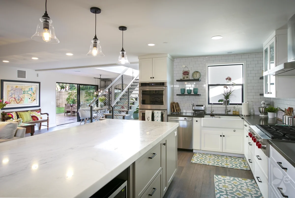 Home Interior Kitchen Island, drawers, Cabinets, Oven, Windows and a view of the staircase and large glass windows